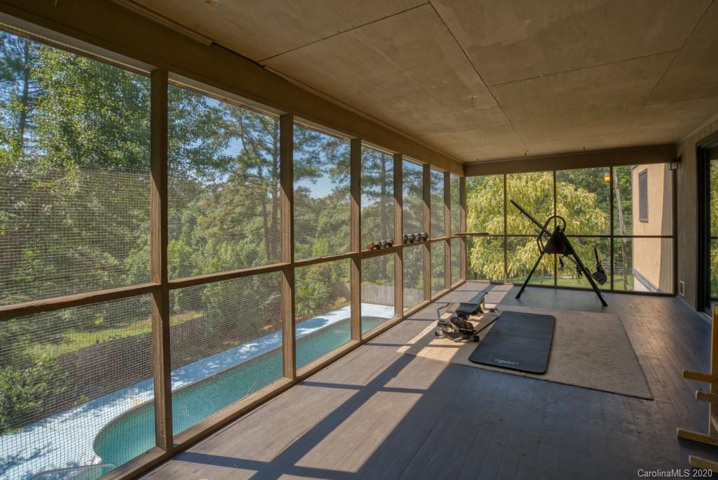 6074 Hunting Country Road Tryon, NC 28782 - Photo 9 of 34 a view of a balcony with lake view and wooden floor