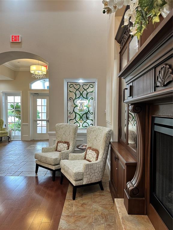 6713 Stone River Road, Unit 206 Bradenton, FL 34203 - Photo 34 of 58 a living room with furniture a window and a fireplace