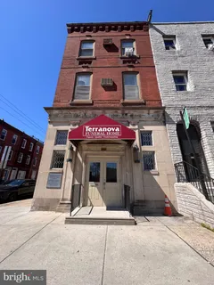 a view of a building with garage