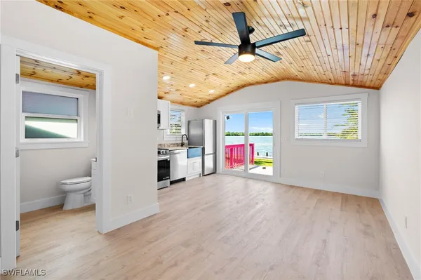 a bathroom with a sink mirror and toilet