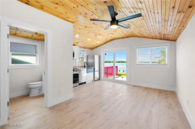 a bathroom with a sink mirror and toilet