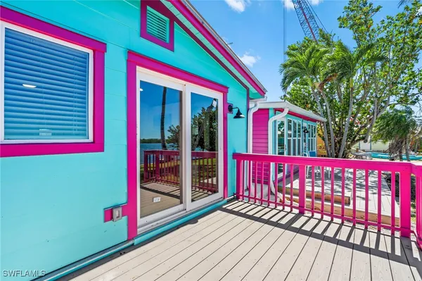 a view of a house with swimming pool and a yard