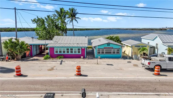 a view of a lake with a table and chairs