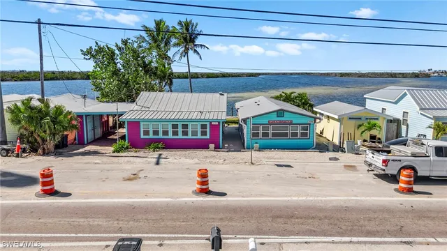 a view of a lake with a table and chairs