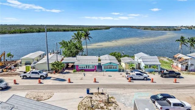 a view of a lake with a table and chairs