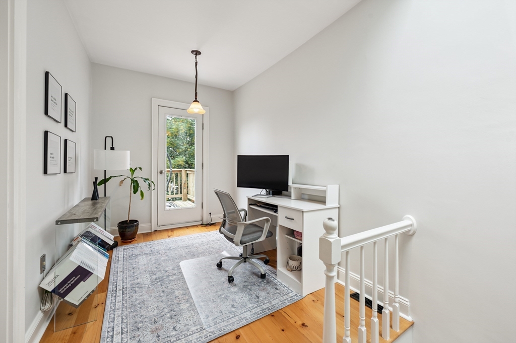 173 H Street, Unit 2 Boston, MA 02127 - Photo 20 of 26 a living room with furniture a flat screen tv and a window