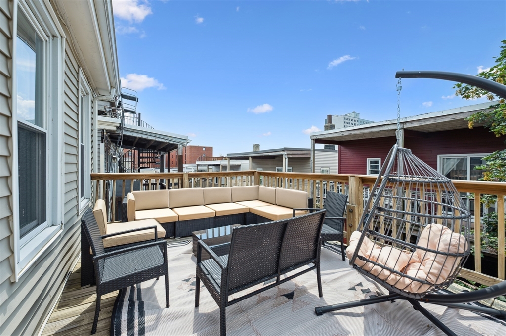 173 H Street, Unit 2 Boston, MA 02127 - Photo 21 of 26 a view of a patio with a table and chairs