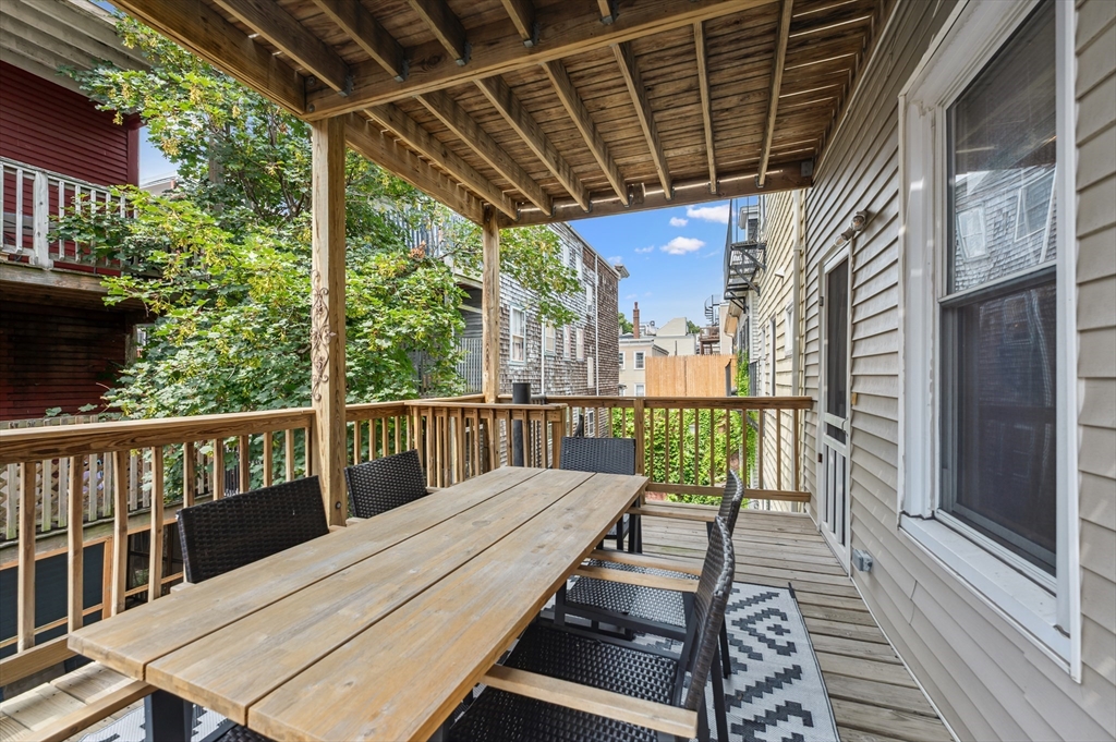 173 H Street, Unit 2 Boston, MA 02127 - Photo 10 of 26 a view of a balcony with wooden floor