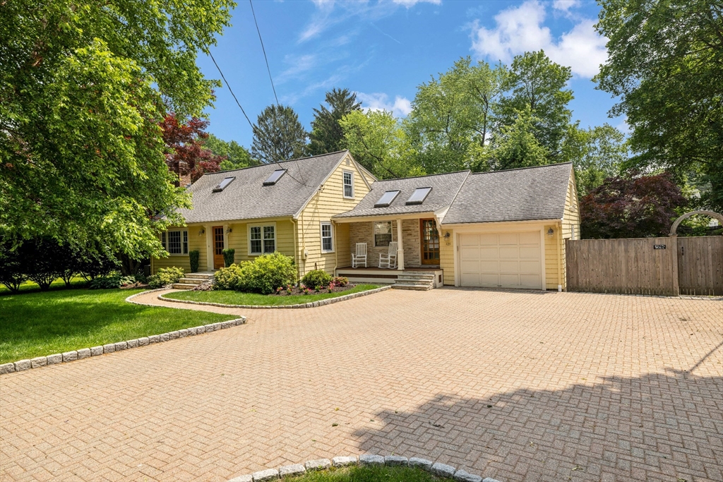 125 Burlington Street Lexington, MA 02420 - Photo 1 of 1 a front view of a house with a yard and trees