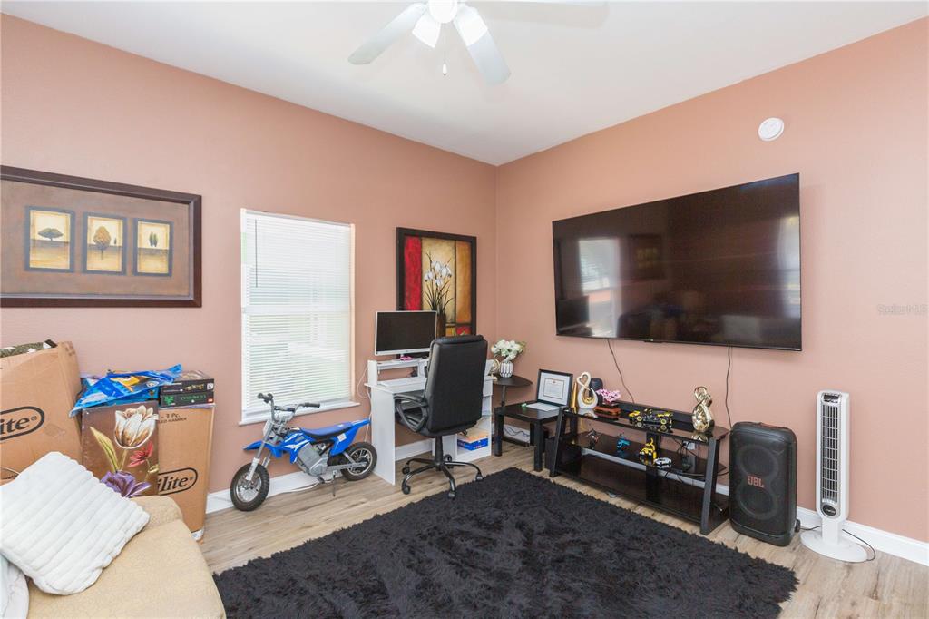 2322 West Cherry Street Tampa, FL 33607 - Photo 4 of 36 a living room with furniture and a flat screen tv