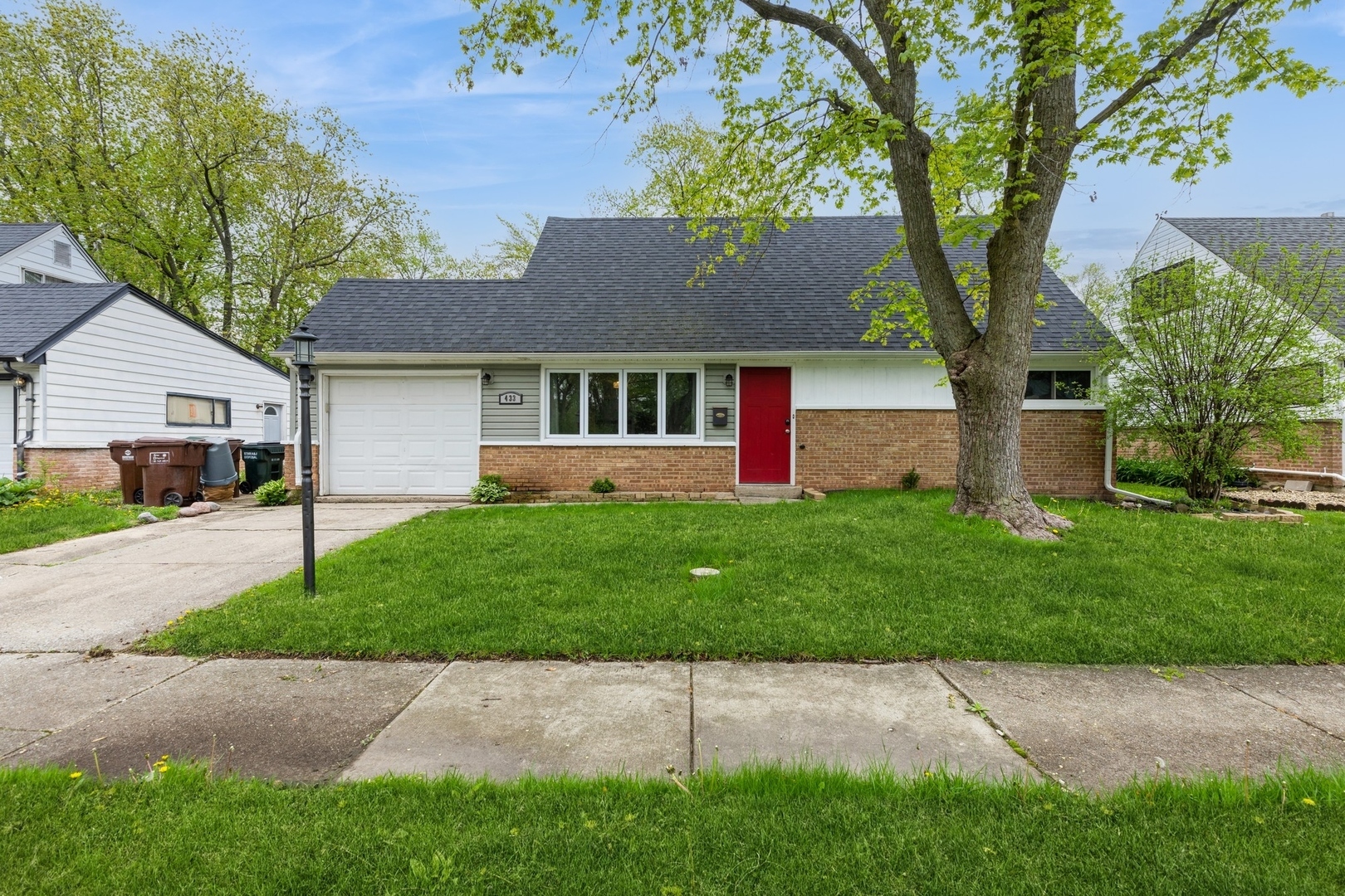 433 Wildwood Drive Park Forest, IL 60466 - Photo 1 of 13 front view of a house with a yard