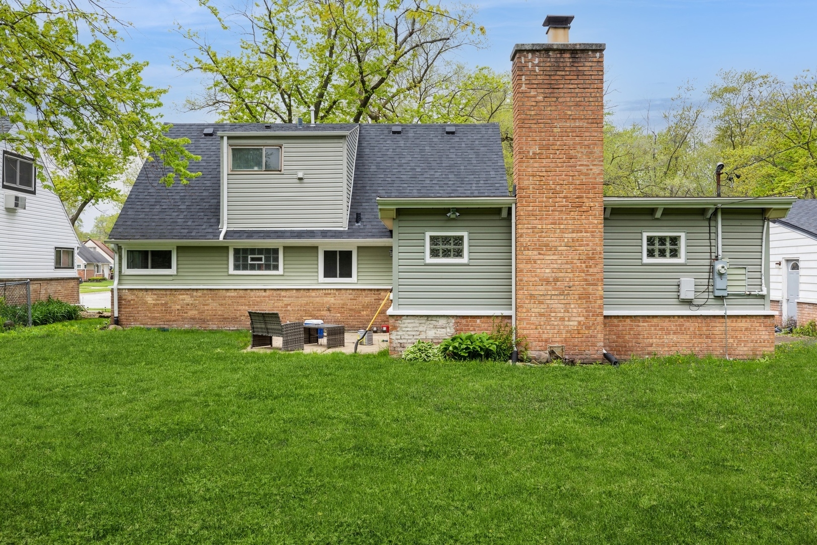 433 Wildwood Drive Park Forest, IL 60466 - Photo 13 of 13 a front view of a house with a yard and trees