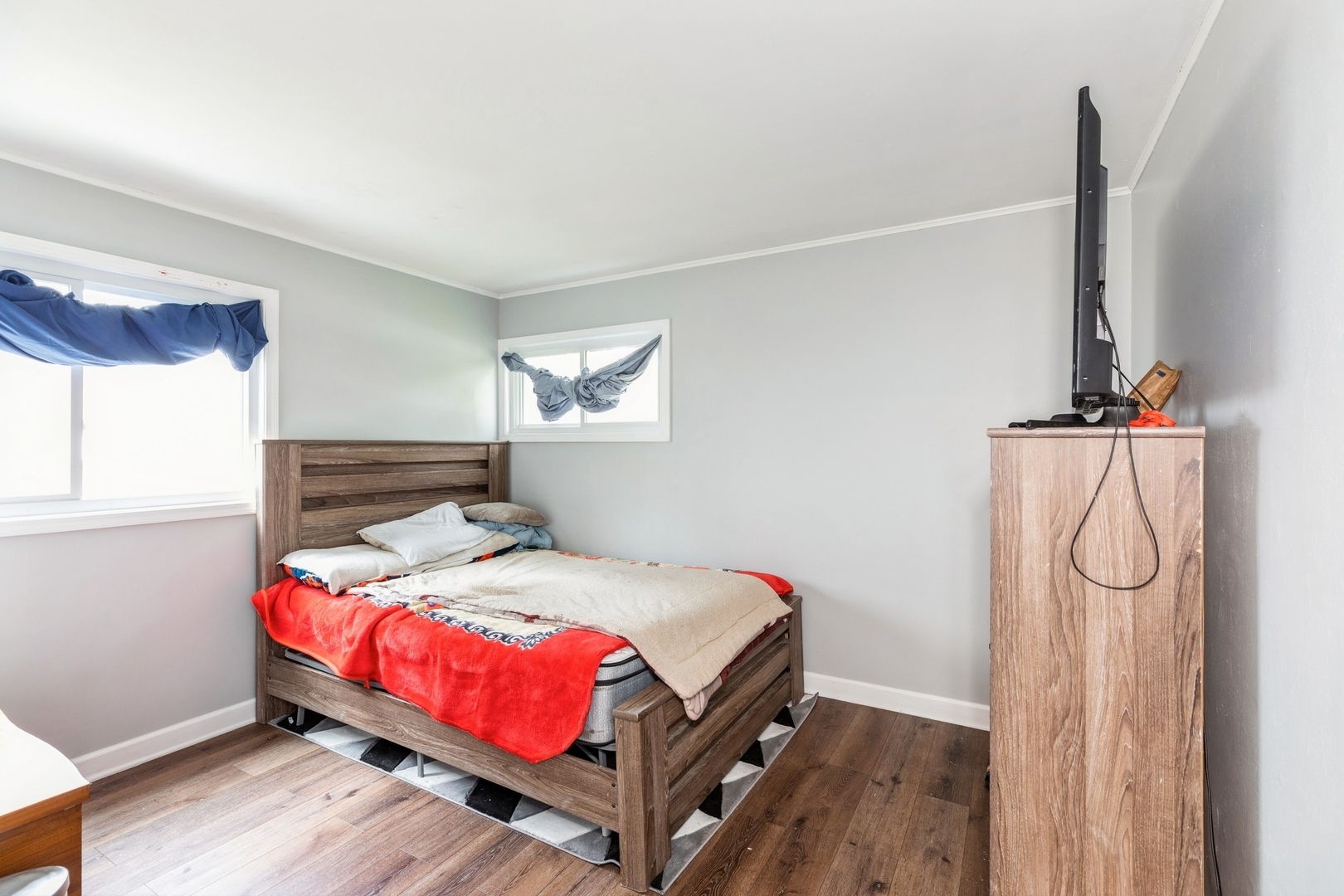 433 Wildwood Drive Park Forest, IL 60466 - Photo 8 of 13 a bedroom with a bed and a window