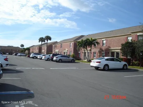 a view of street with parked cars