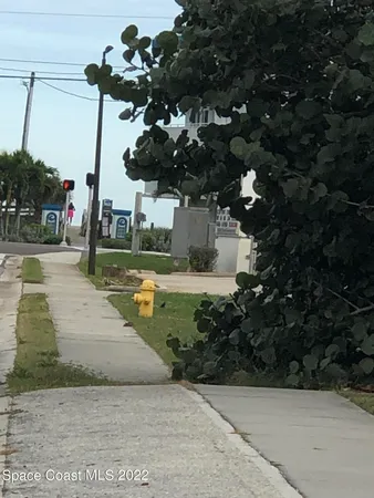 a view of a balcony with wooden floor