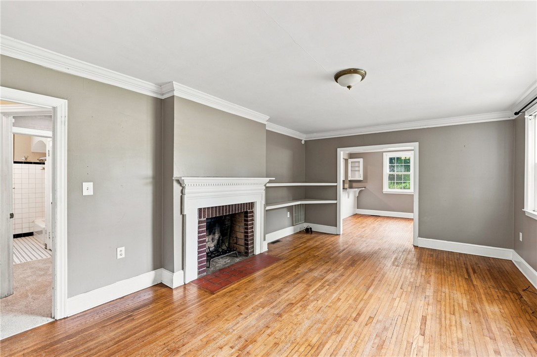 98 Blue Ridge Drive Clemson, SC 29631 - Photo 6 of 32 Rich hardwood floors and a classic fireplace anchor this open living area.