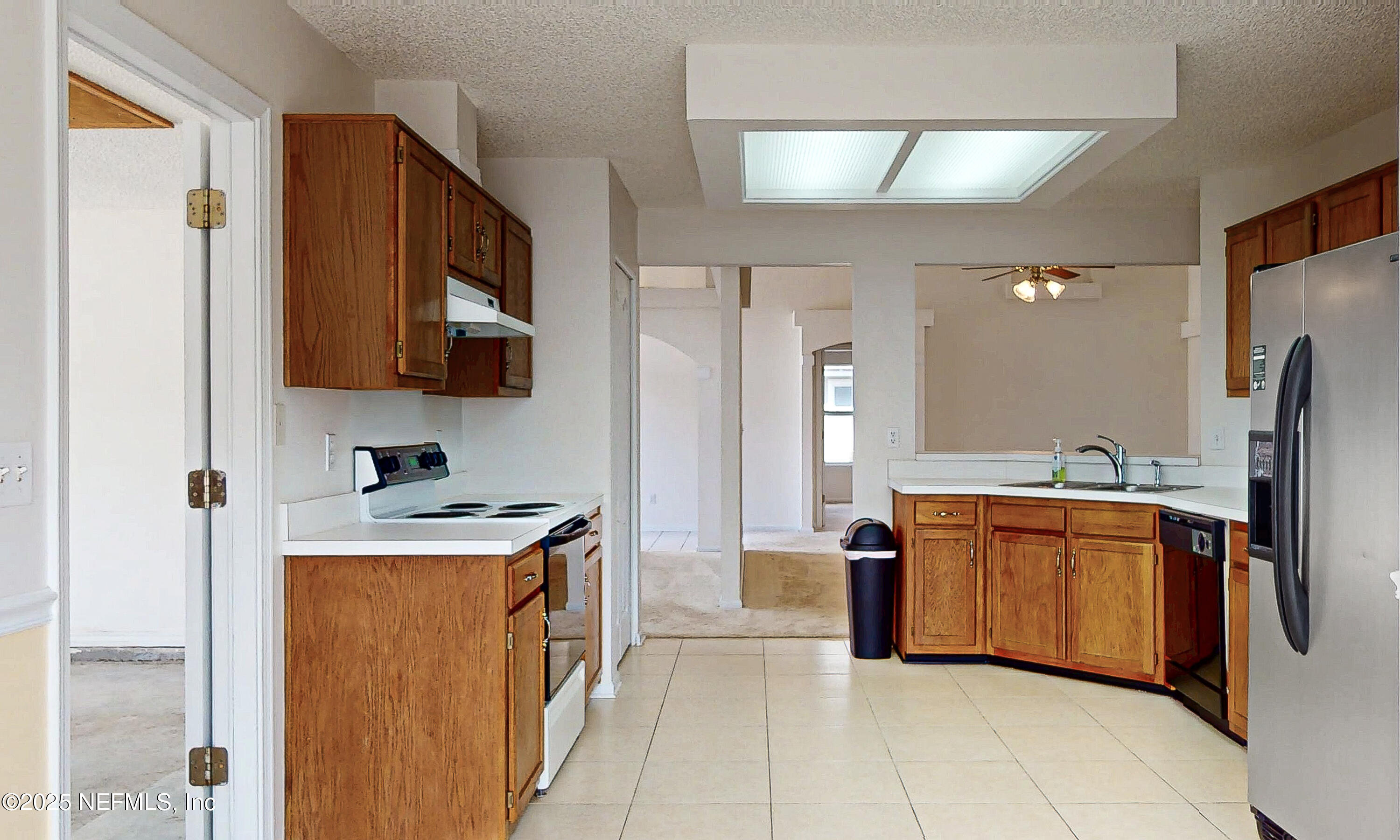2031 Canyon Rim Place Middleburg, FL 32068 - Photo 11 of 38 a kitchen with stainless steel appliances granite countertop a refrigerator and a stove top oven