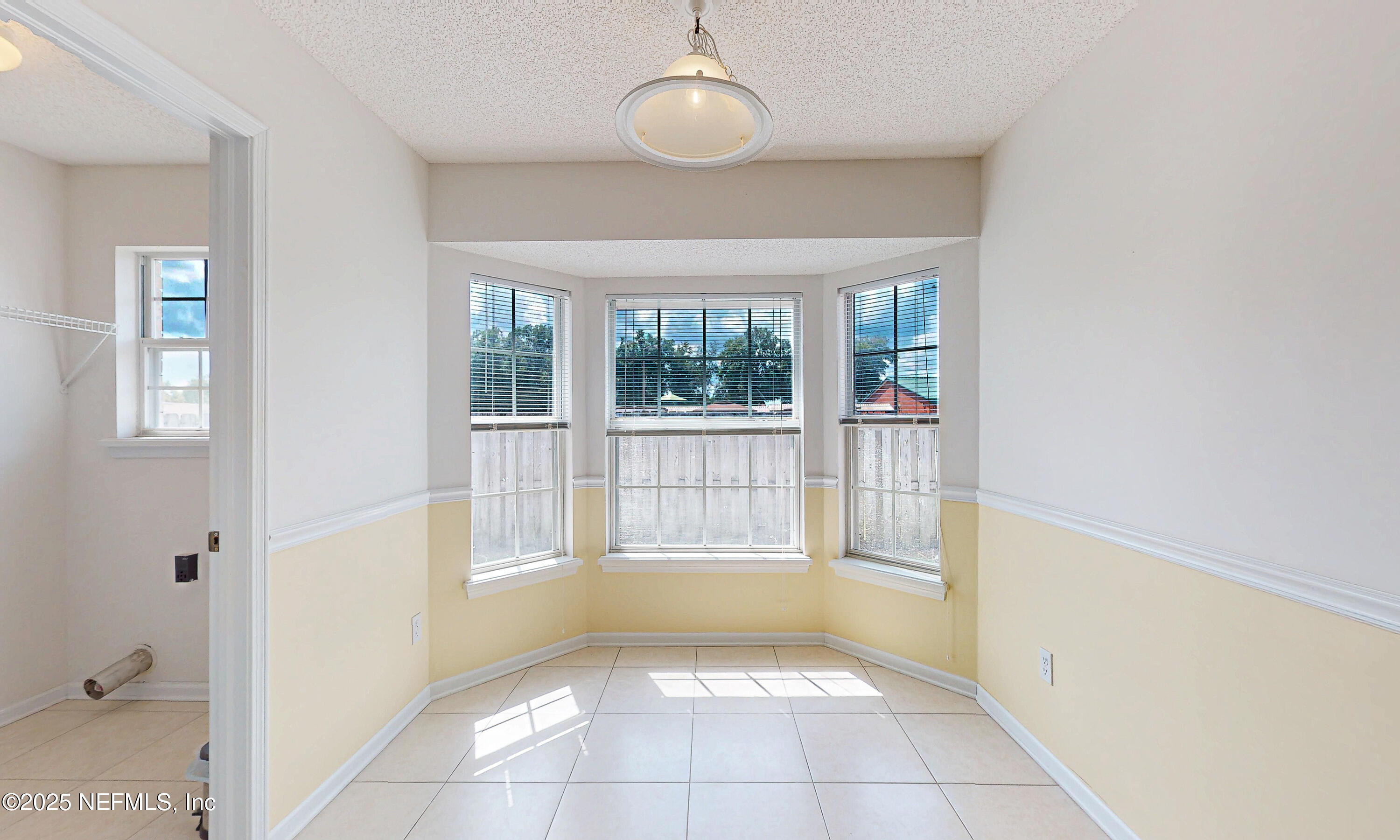 2031 Canyon Rim Place Middleburg, FL 32068 - Photo 12 of 38 a view of an empty room with a window