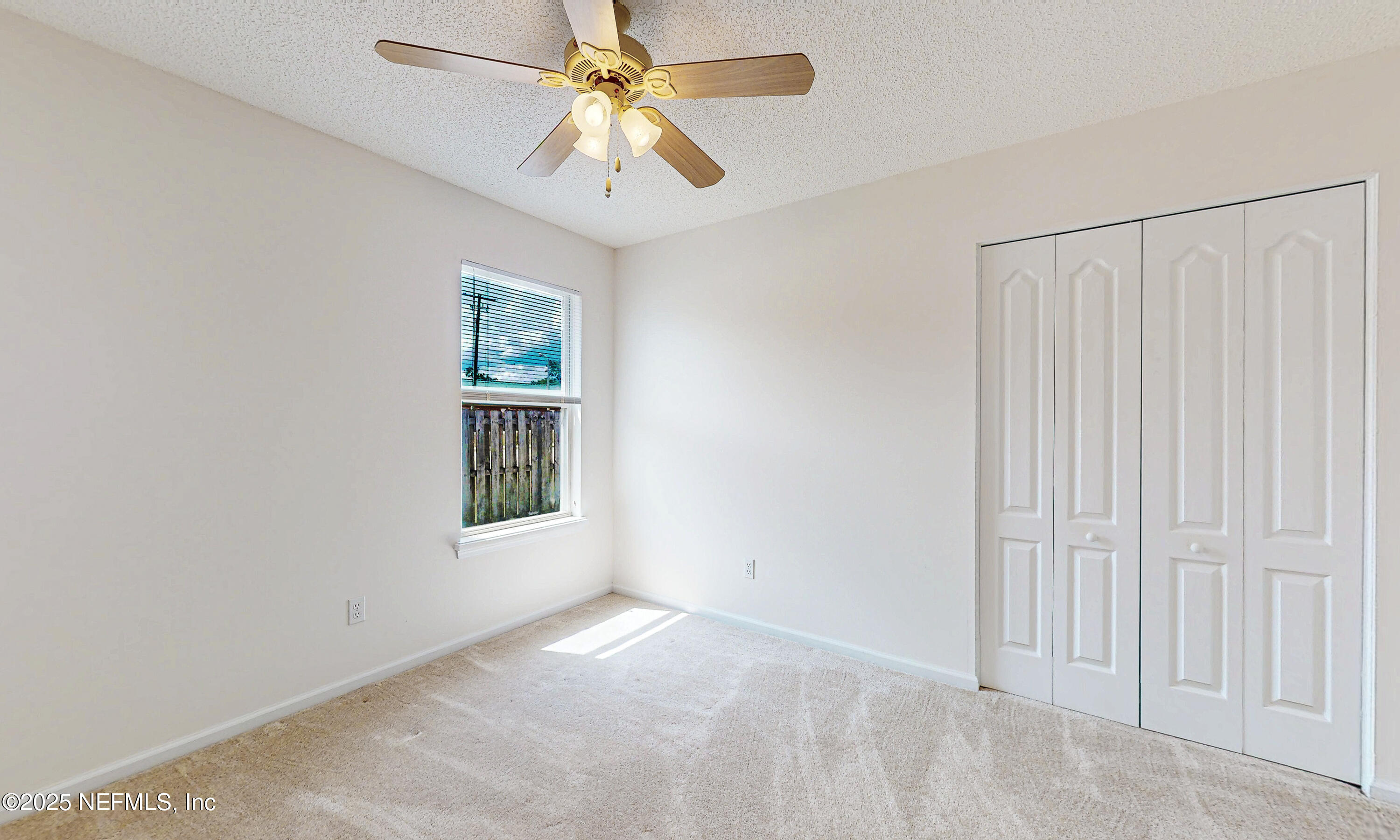 2031 Canyon Rim Place Middleburg, FL 32068 - Photo 15 of 38 an empty room with windows and fan