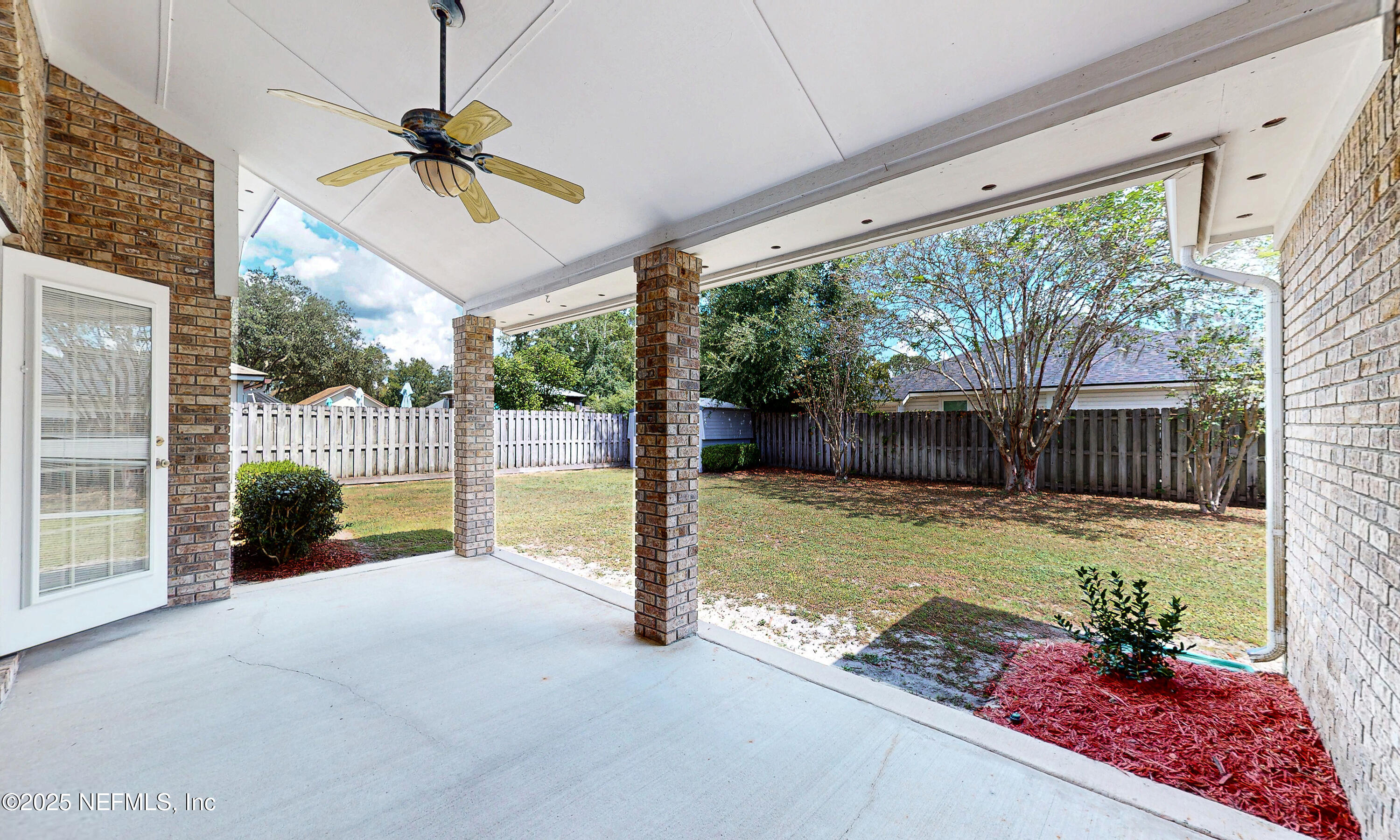 2031 Canyon Rim Place Middleburg, FL 32068 - Photo 18 of 38 a view of a porch with furniture and garden