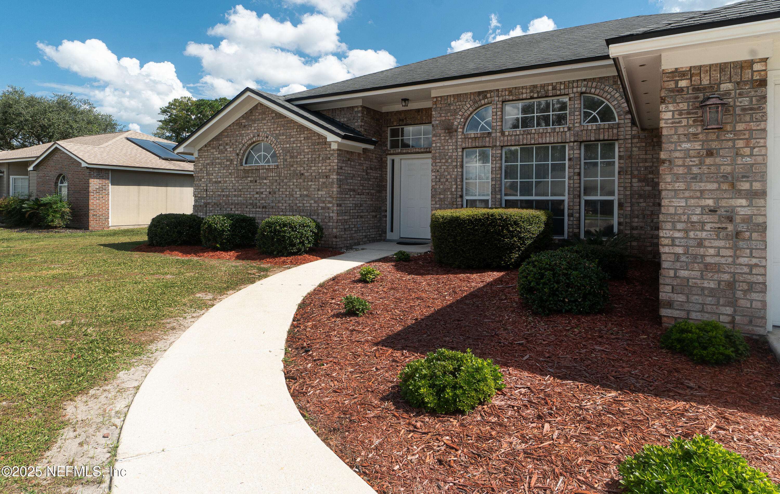 2031 Canyon Rim Place Middleburg, FL 32068 - Photo 2 of 38 a front view of a house with a yard
