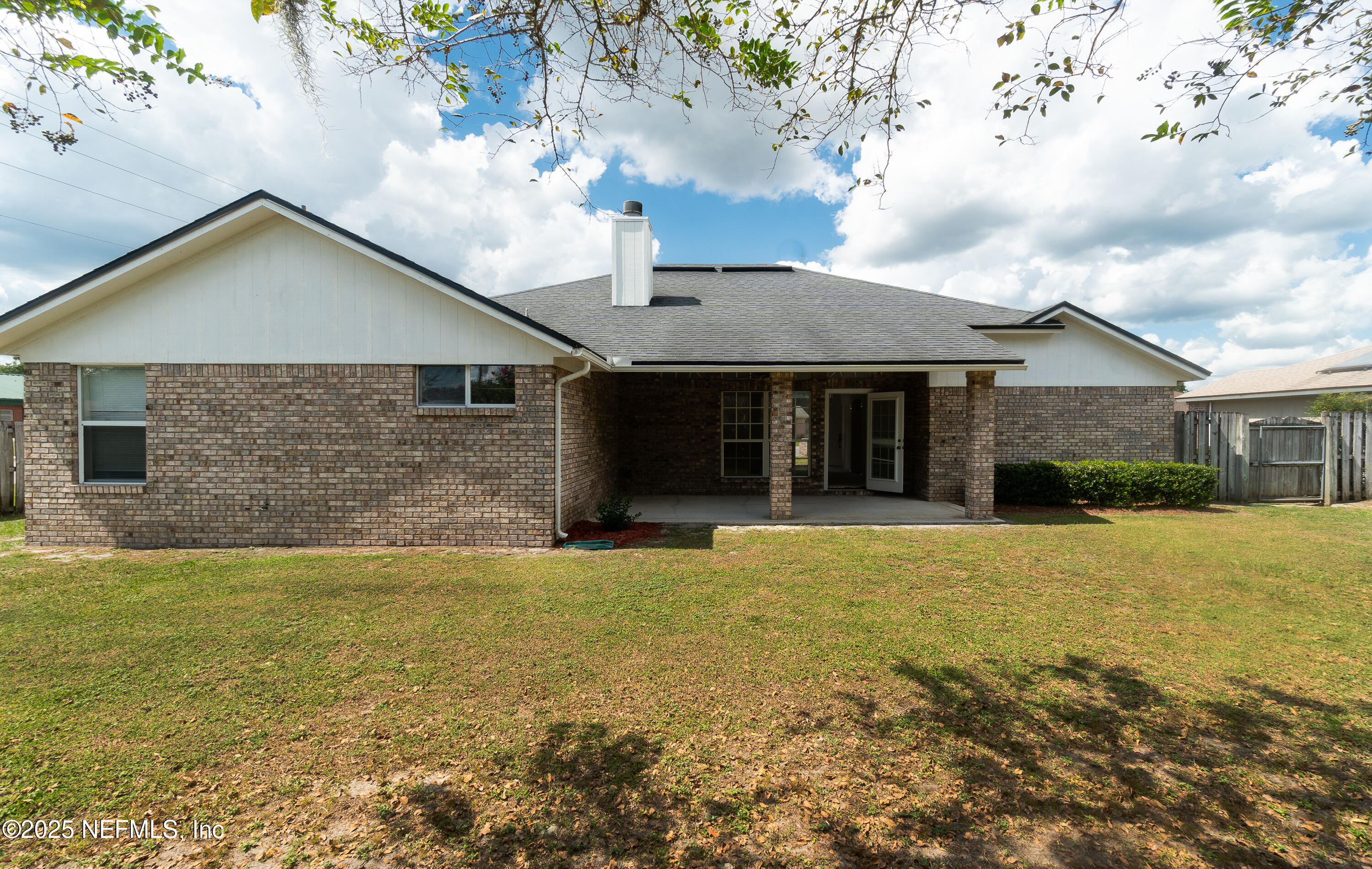 2031 Canyon Rim Place Middleburg, FL 32068 - Photo 23 of 38 a front view of a house with a garden