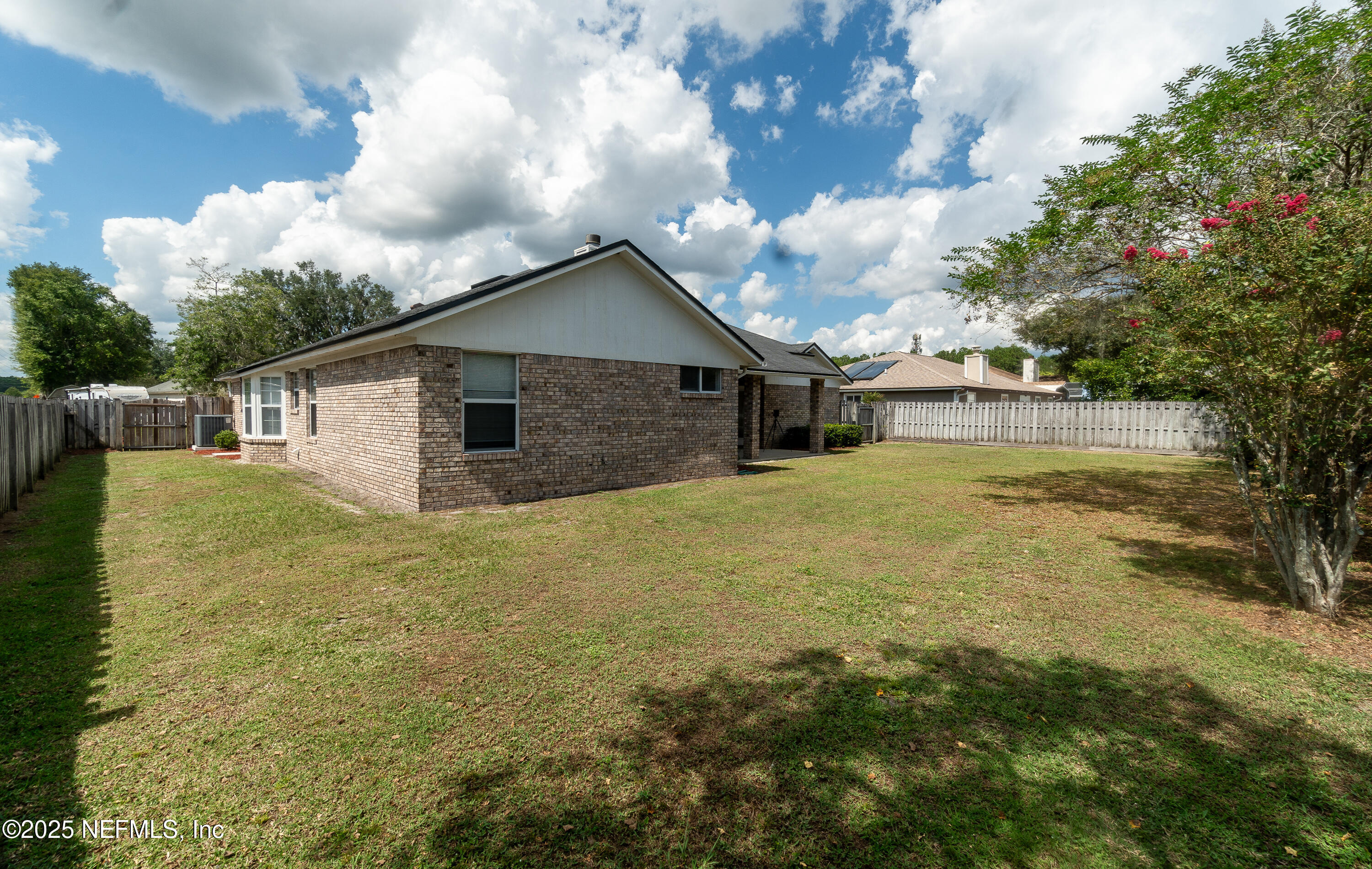 2031 Canyon Rim Place Middleburg, FL 32068 - Photo 27 of 38 a view of a house with pool and a yard