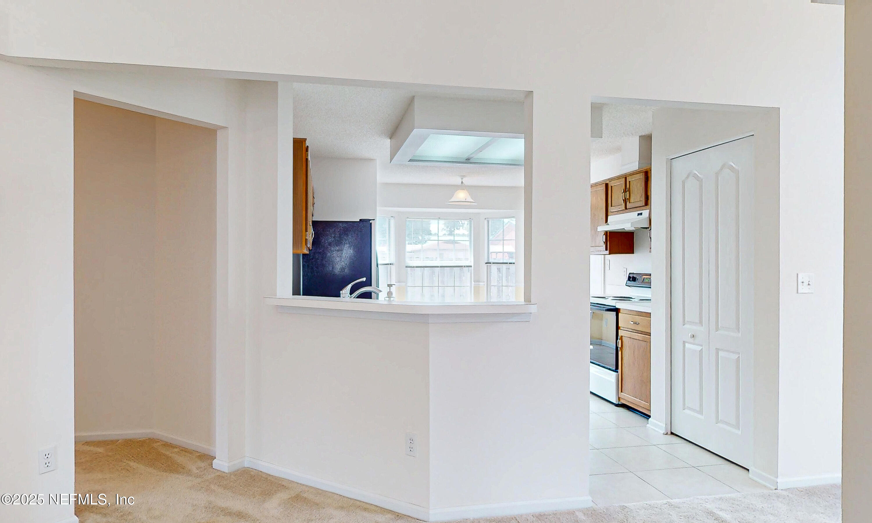 2031 Canyon Rim Place Middleburg, FL 32068 - Photo 31 of 38 a view of a kitchen from the hallway