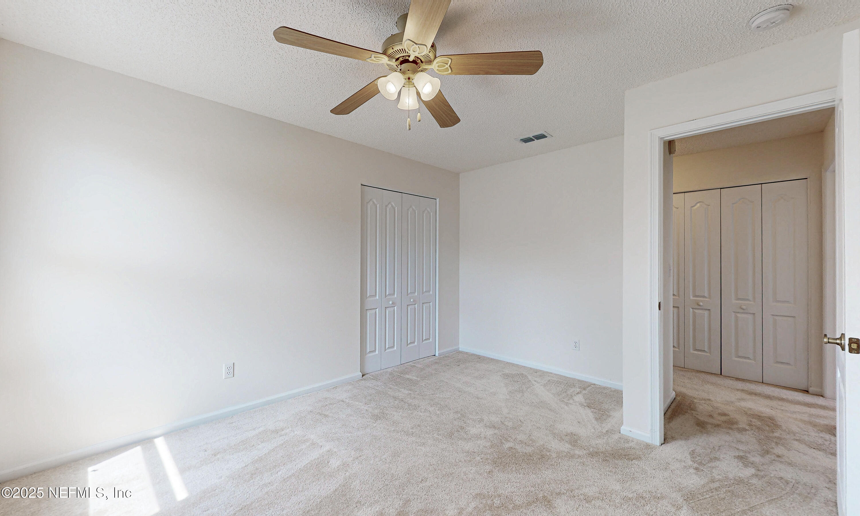 2031 Canyon Rim Place Middleburg, FL 32068 - Photo 34 of 38 an empty room with chandelier fan