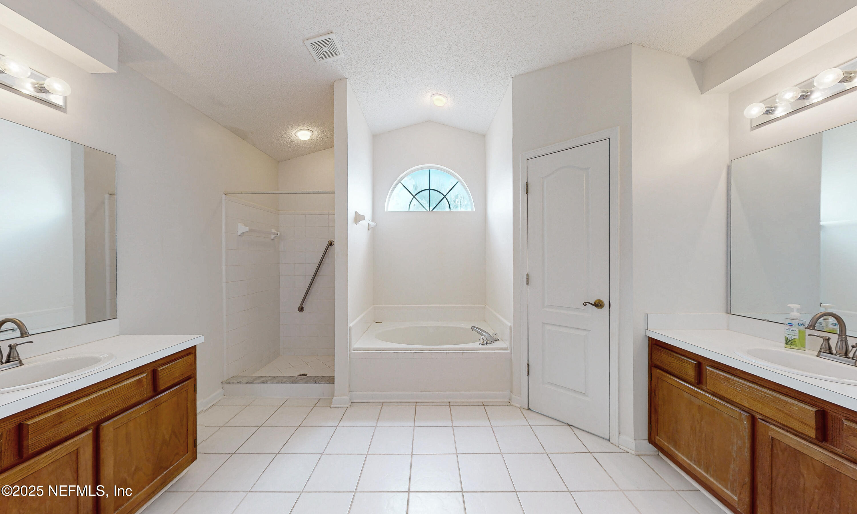 2031 Canyon Rim Place Middleburg, FL 32068 - Photo 7 of 38 a bathroom with a bathtub a sink a toilet and a shower