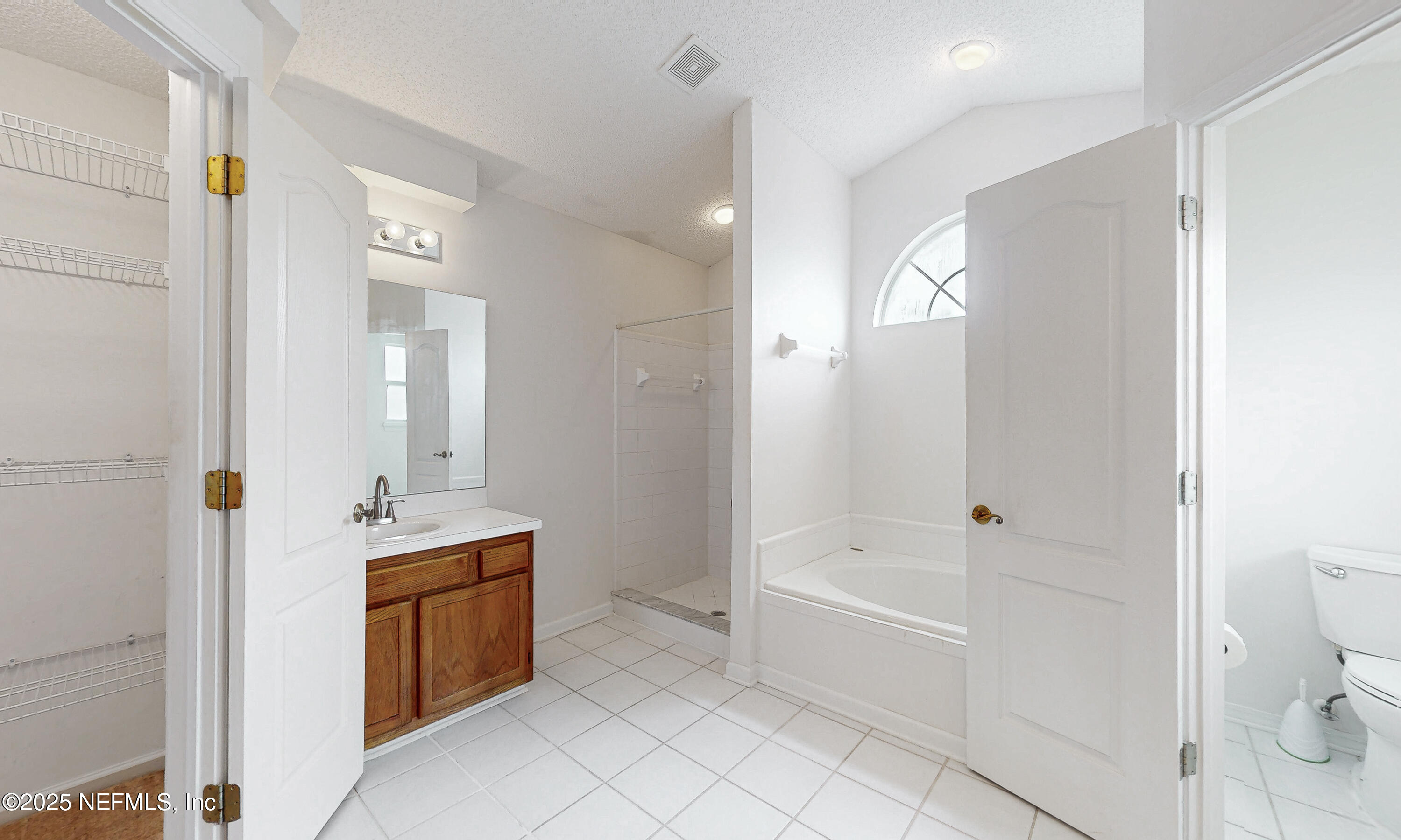 2031 Canyon Rim Place Middleburg, FL 32068 - Photo 8 of 38 a bathroom with a bathtub sink and toilet