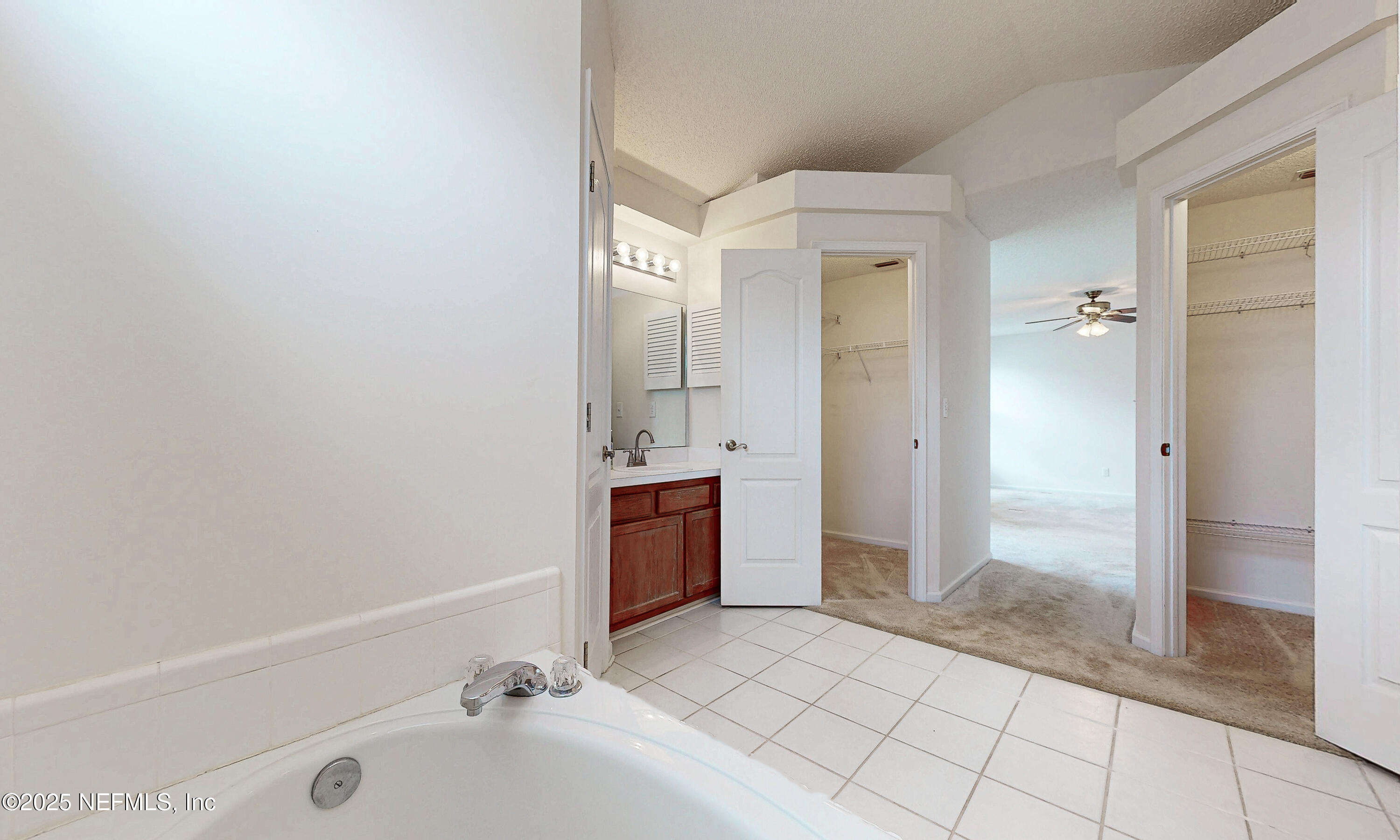 2031 Canyon Rim Place Middleburg, FL 32068 - Photo 9 of 38 a bathroom with a tub shower and sink