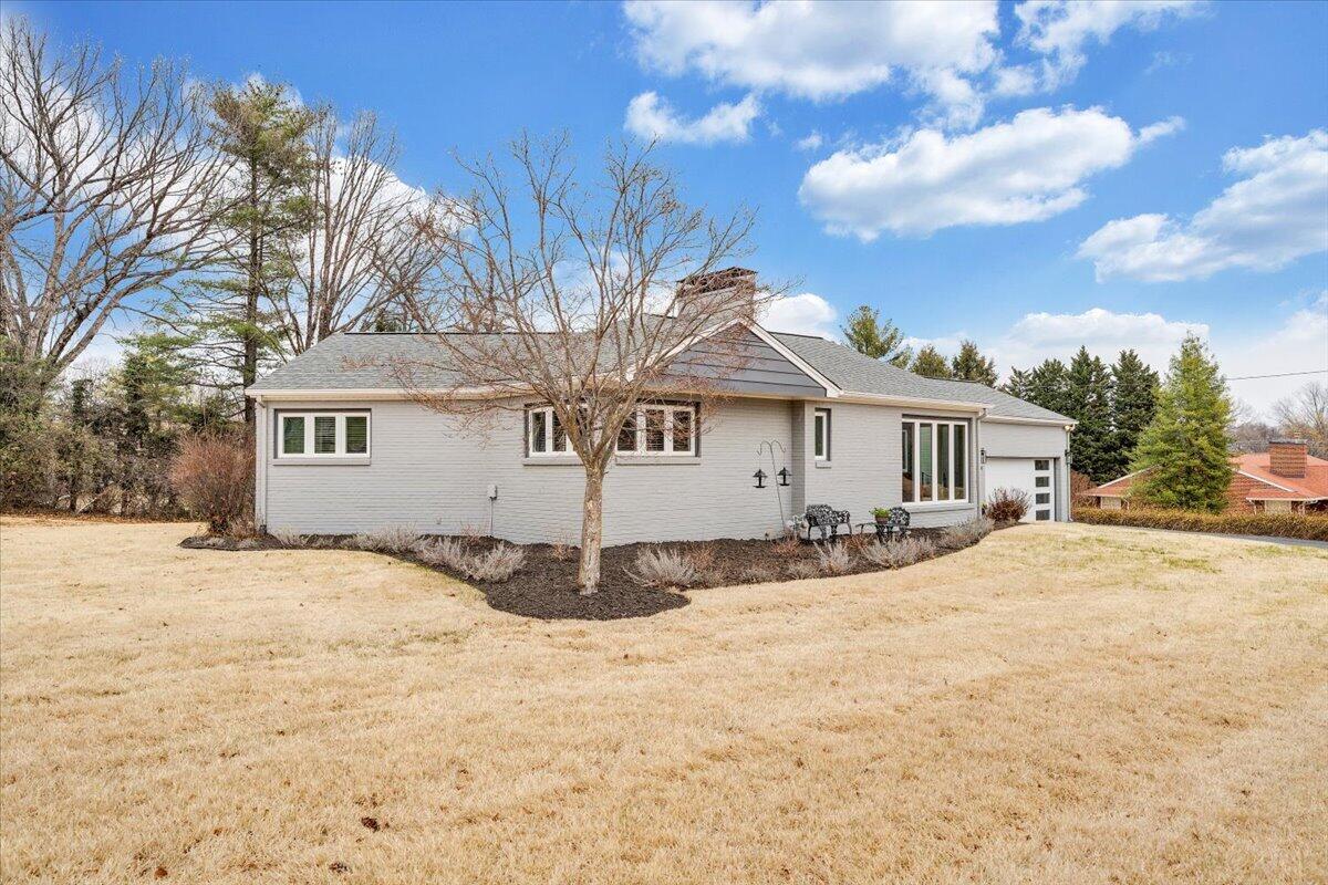 3531 Winding Way Road Southwest Roanoke, VA 24015 - Photo 19 of 70 a front view of a house with a yard covered in snow