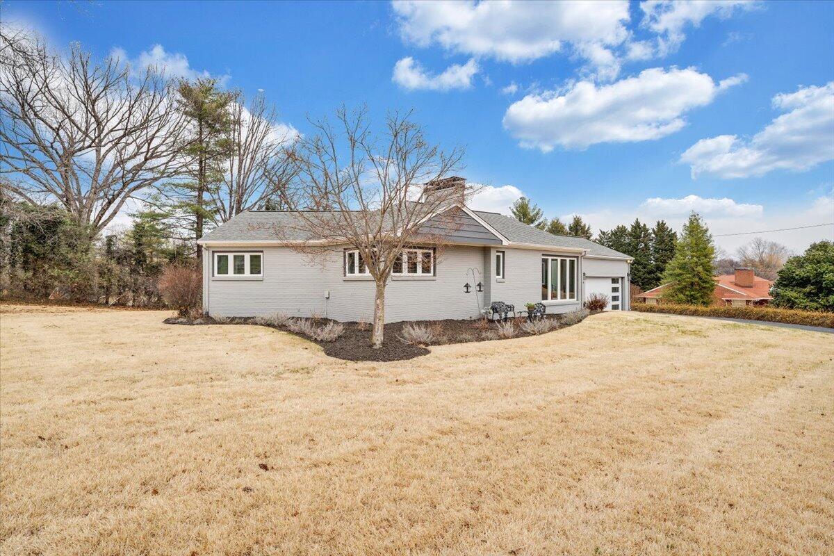 3531 Winding Way Road Southwest Roanoke, VA 24015 - Photo 20 of 70 a front view of a house with a yard covered with snow