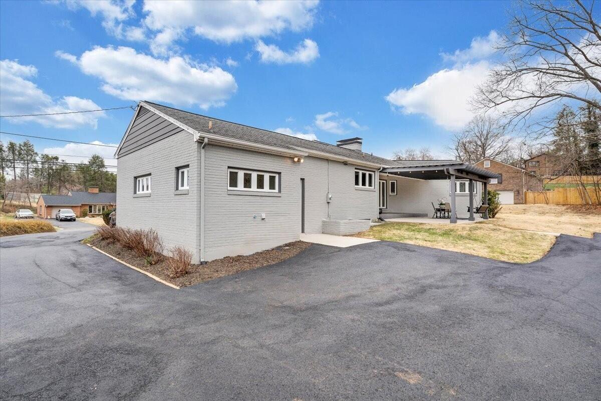 3531 Winding Way Road Southwest Roanoke, VA 24015 - Photo 27 of 70 a view of a house with backyard and a parked