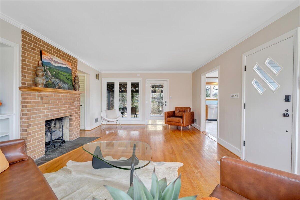 3531 Winding Way Road Southwest Roanoke, VA 24015 - Photo 33 of 70 a living room with furniture and a fireplace with wooden floor