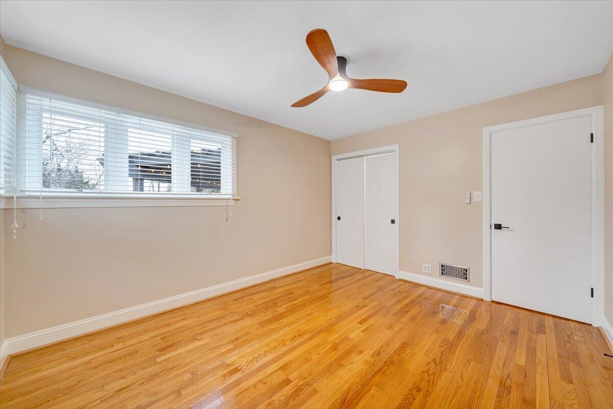 3531 Winding Way Road Southwest Roanoke, VA 24015 - Photo 51 of 70 a view of an empty room with wooden floor and a window