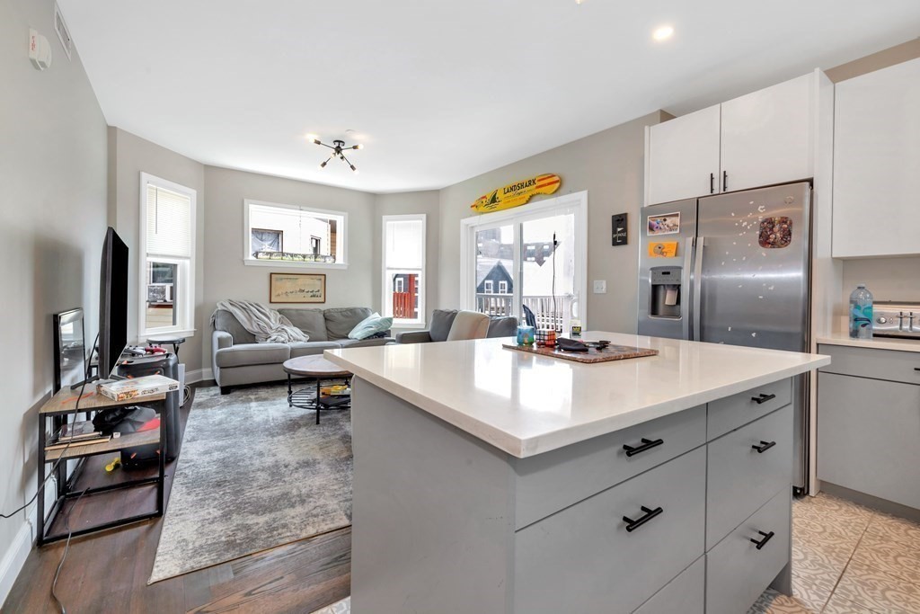 777 Columbia Road, Unit 3 Boston, MA 02125 - Photo 15 of 21 a living room with furniture and a flat screen tv