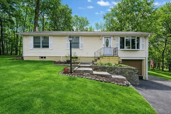 front view of a house with a yard