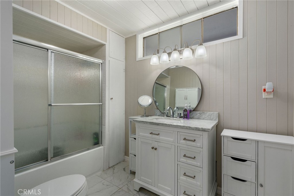 24 B Surfside Avenue Surfside, CA 90743 - Photo 13 of 22 a bathroom with a toilet sink and shower