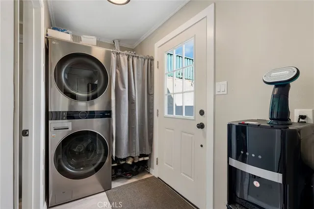 a view of a hallway with washer and dryer