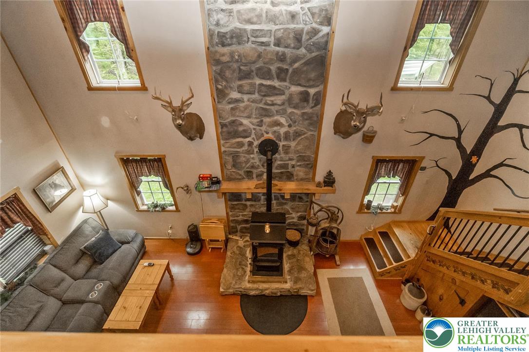9223 North Loop Road Slatington, PA 18080 - Photo 21 of 60 a living room with fireplace furniture and a flat screen tv