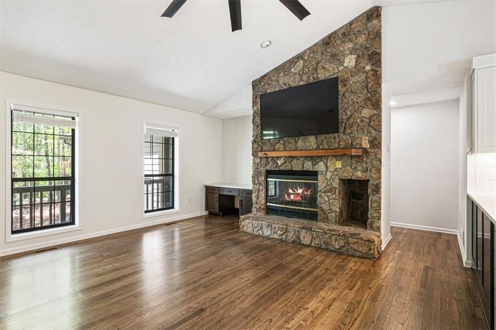 190 Red Coat Pass Jasper, GA 30143 - Photo 3 of 43 a living room with furniture a flat screen tv and a fireplace