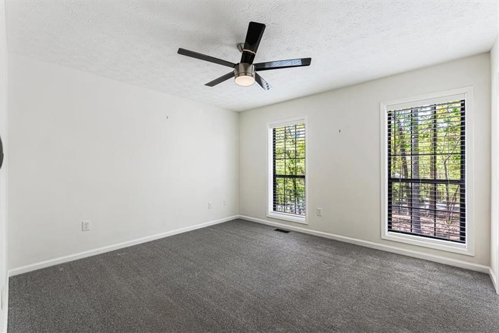 190 Red Coat Pass Jasper, GA 30143 - Photo 31 of 43 an empty room with ceiling fan and windows
