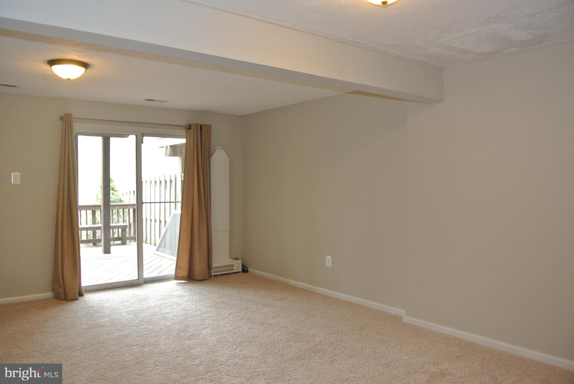 8732 Silver Hall Road Perry Hall, MD 21128 - Photo 25 of 30 Lower level family room with sliders rear patio