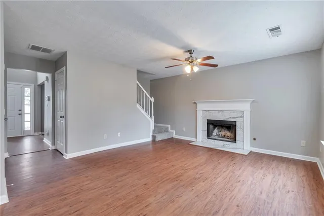 wooden floor in an empty room with a fireplace
