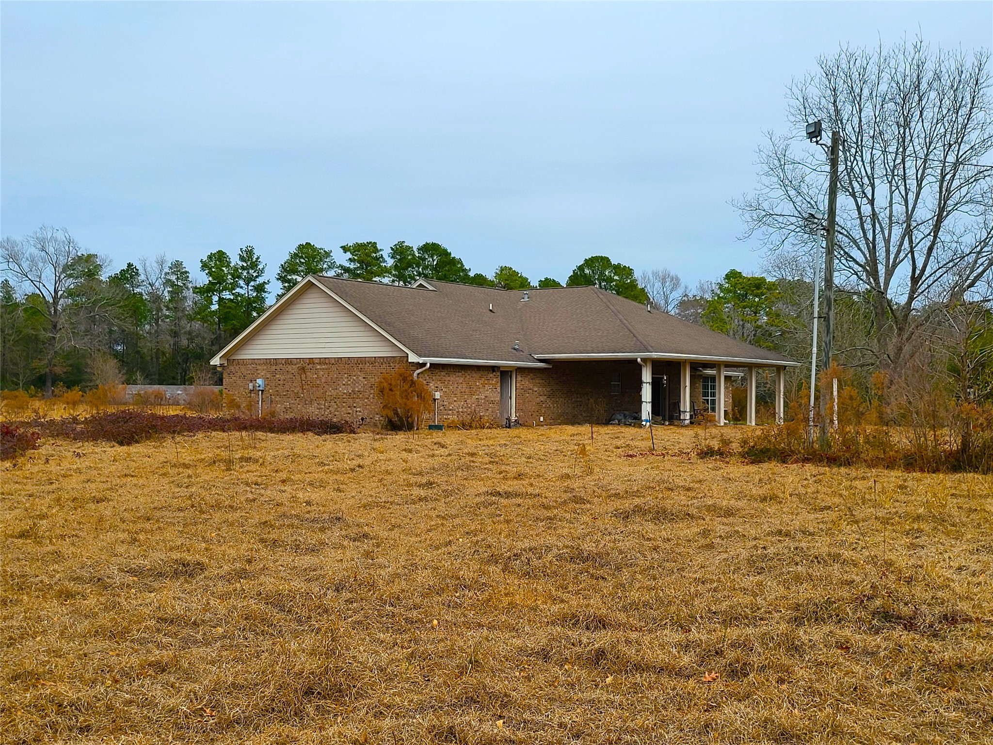 19320 Willaby Road New Caney, TX 77357 - Photo 11 of 14 a front view of a house with a yard