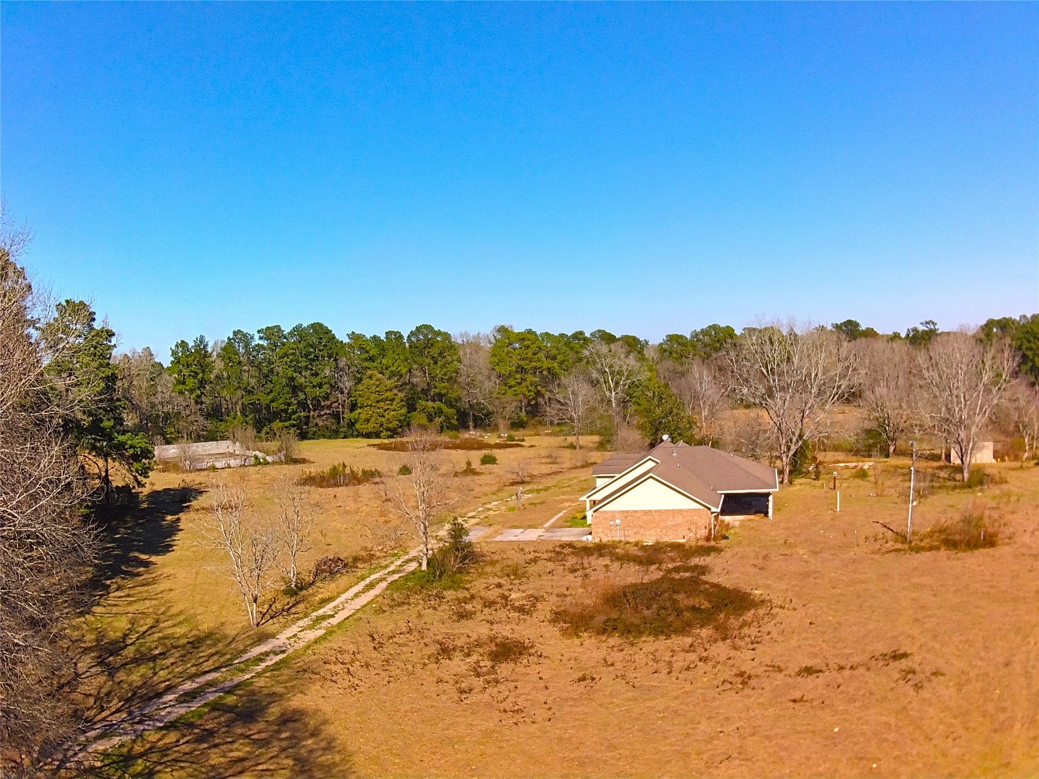19320 Willaby Road New Caney, TX 77357 - Photo 14 of 14 a view of a lake with houses in the background
