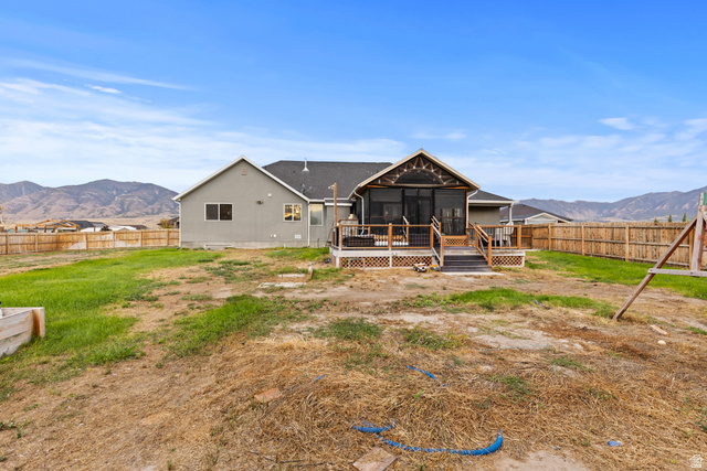 4557 North Ranch Road East Tooele, UT 84074 - Photo 33 of 43 Screened-in porch with wood decking