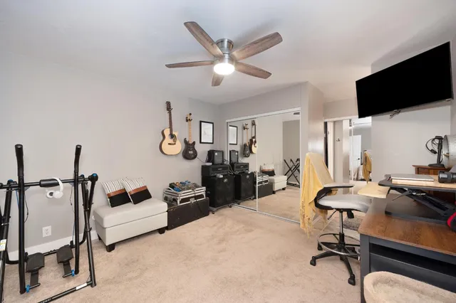 a bathroom with a sink vanity mirror and toilet